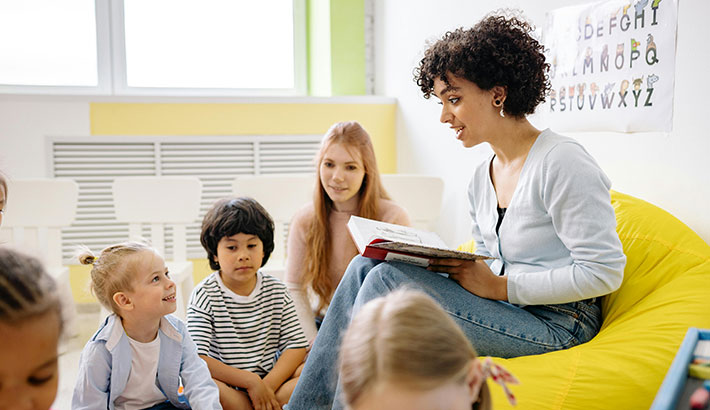 Children Listening to their Teacher Read