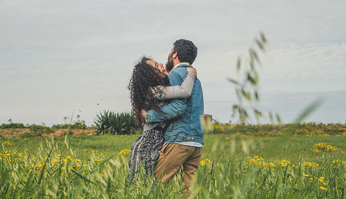 Couple Embracing in a Field