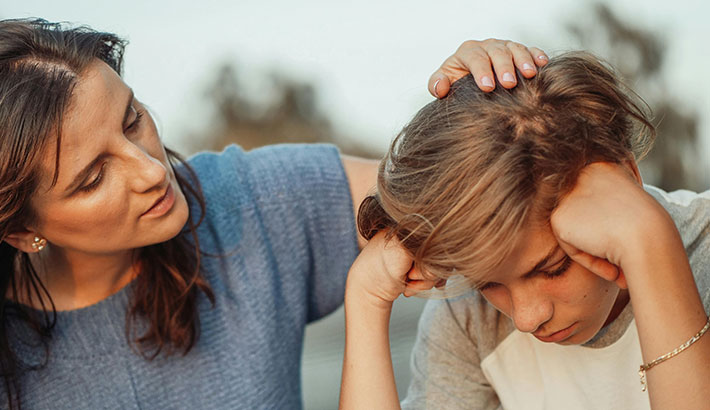 Mother Helping a Sad Child