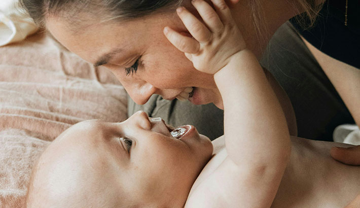 Mother's Face Close to Her Baby's Face